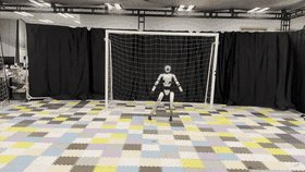 Humanoid goalkeeper intercepting a ball